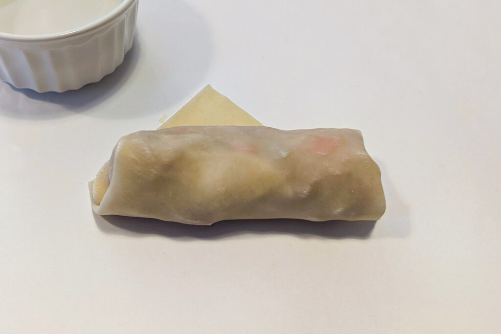 Wrapping an egg roll.
