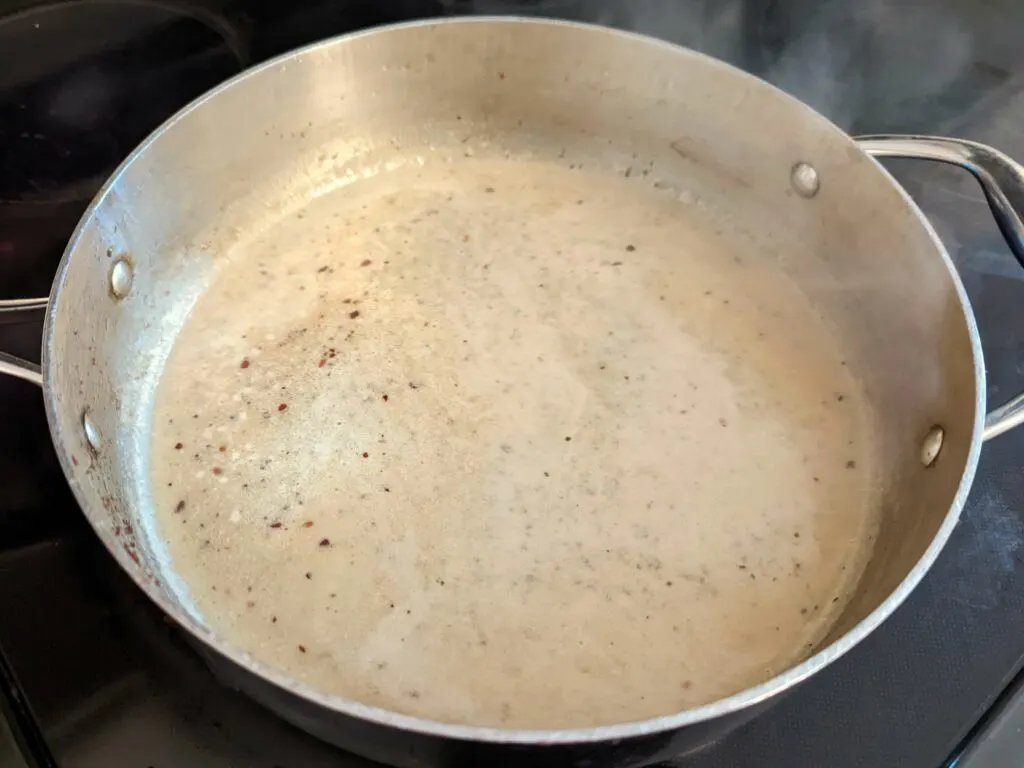 Add heavy cream, water, pepper, salt, and garlic powder. Then, stir in the cornstarch.