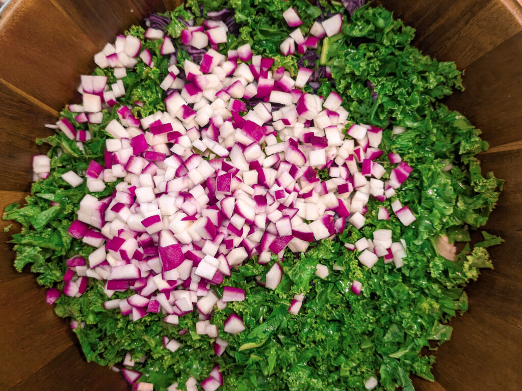 Diced radish added to a bowl.