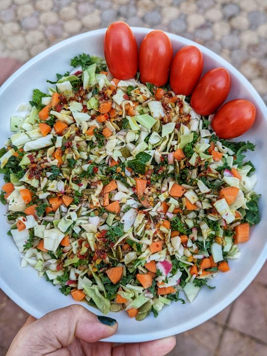 Our chopped salad recipe topped with tomatoes.