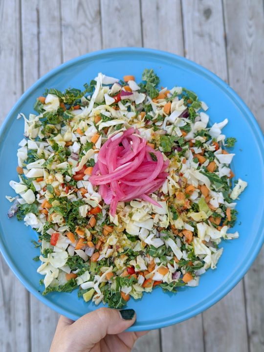 Our chopped salad recipe is garnished with sweet pickled onion.