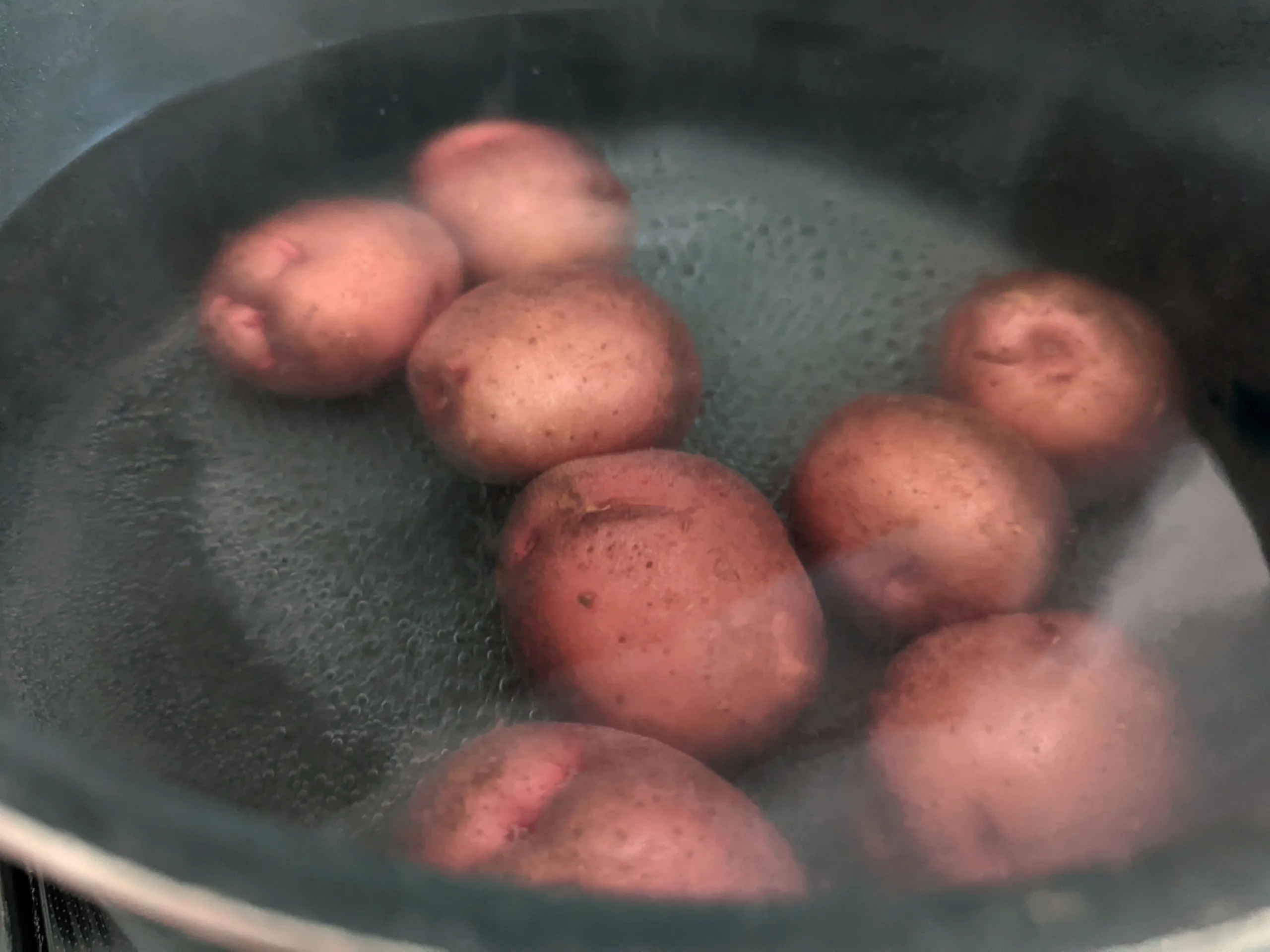 Potatoes boiling in a stock pot. 