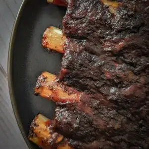 Beef ribs on a cutting board.