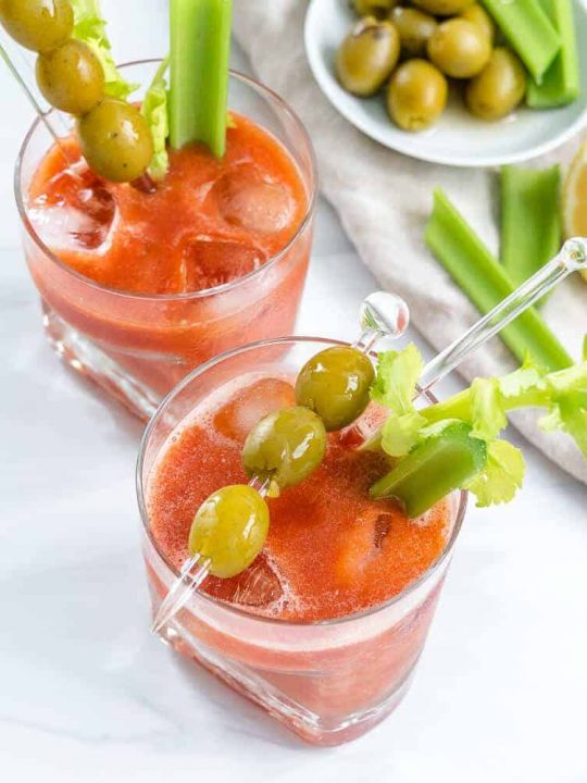 Make a virgin bloody mary mocktail recipes and top it with olives and celery.