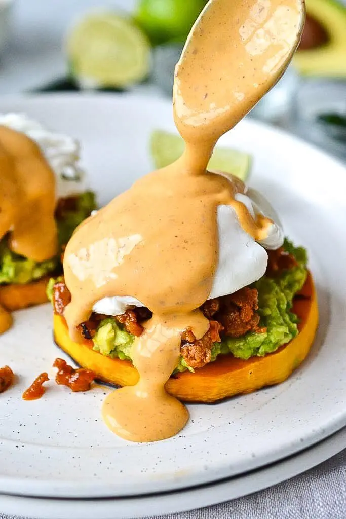 Homemade sauce over mexican eggs benedict.