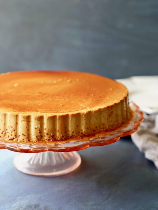 Perfect flan displayed on a cake stand.