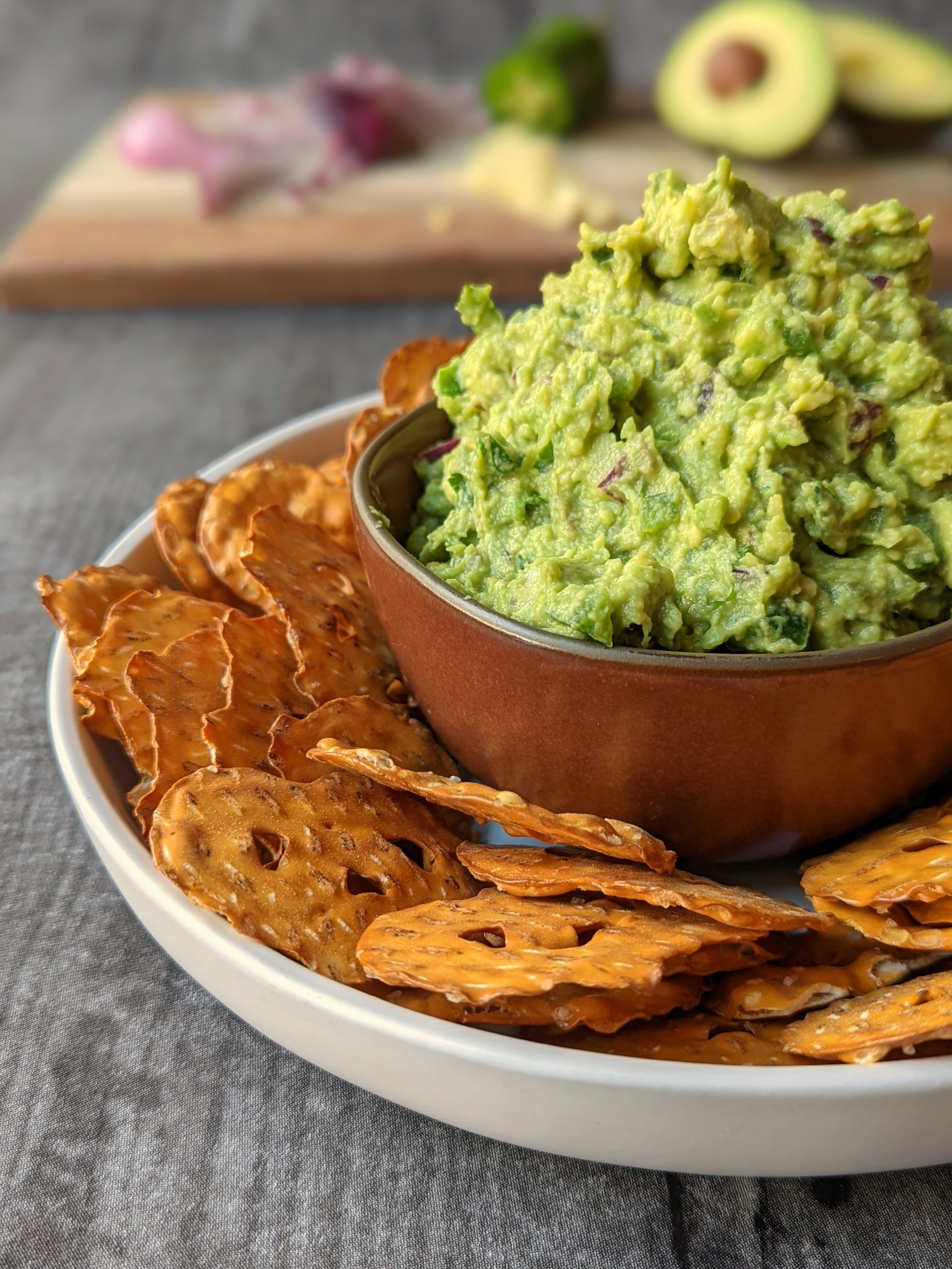 This is our simple guacamole recipe served with pretzel chips.