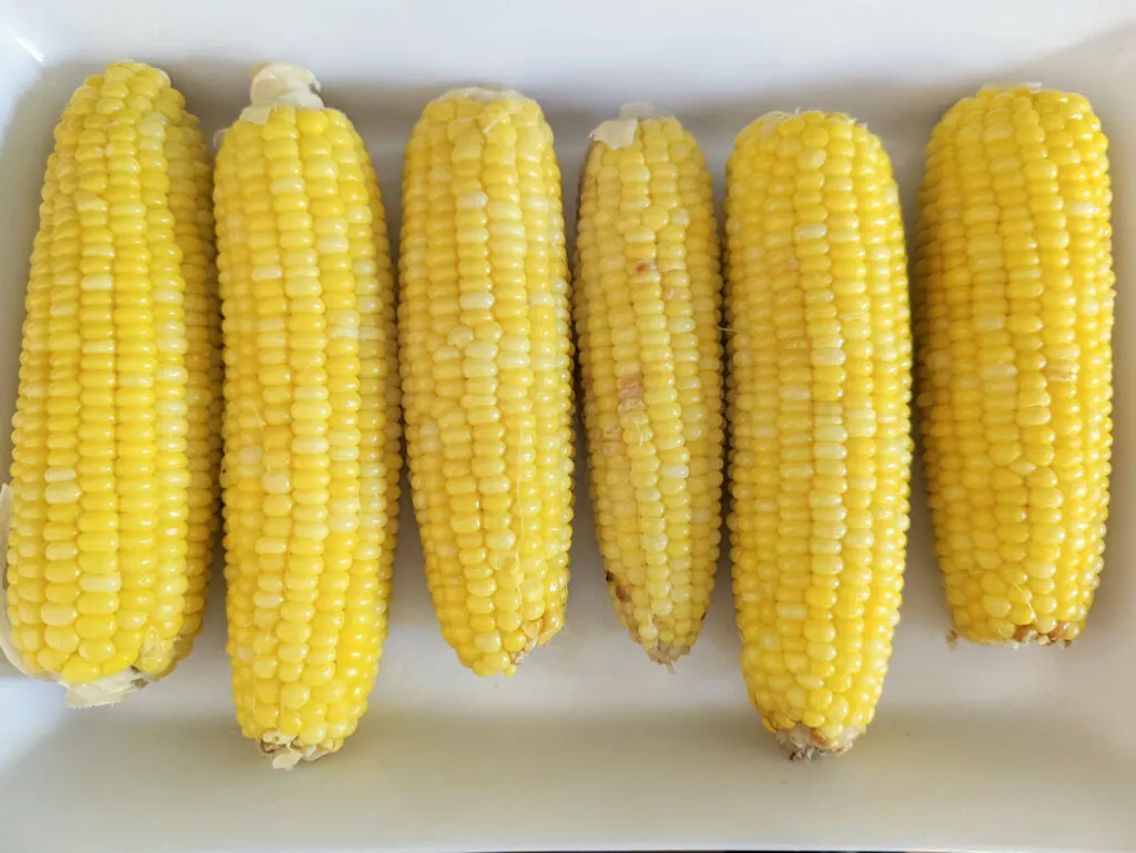 Stovetop corn on the cob on a serving tray.