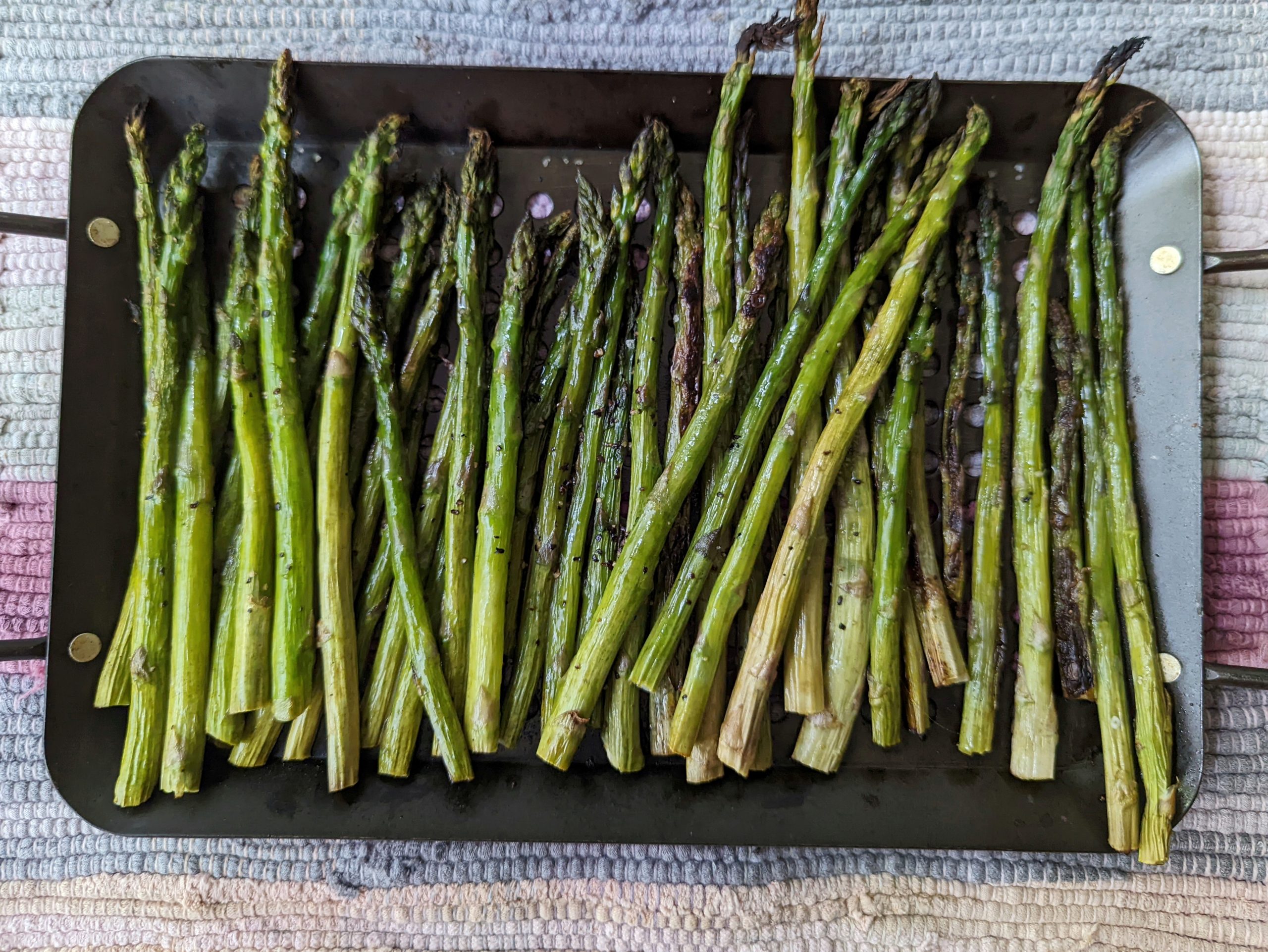 Grilled asparagus is ready to be served.