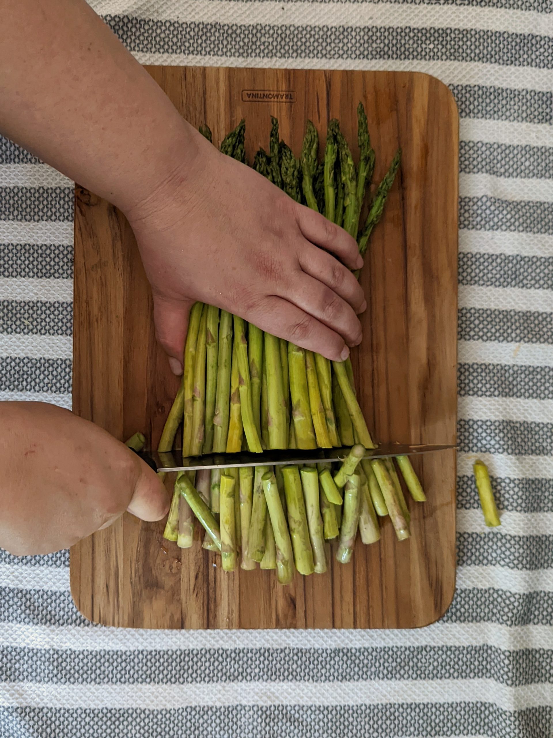 Trim the rough ends of the asparagus off of the stalk.