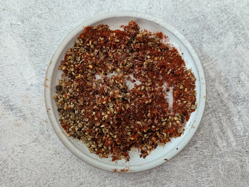 Ground spices on a small plate.
