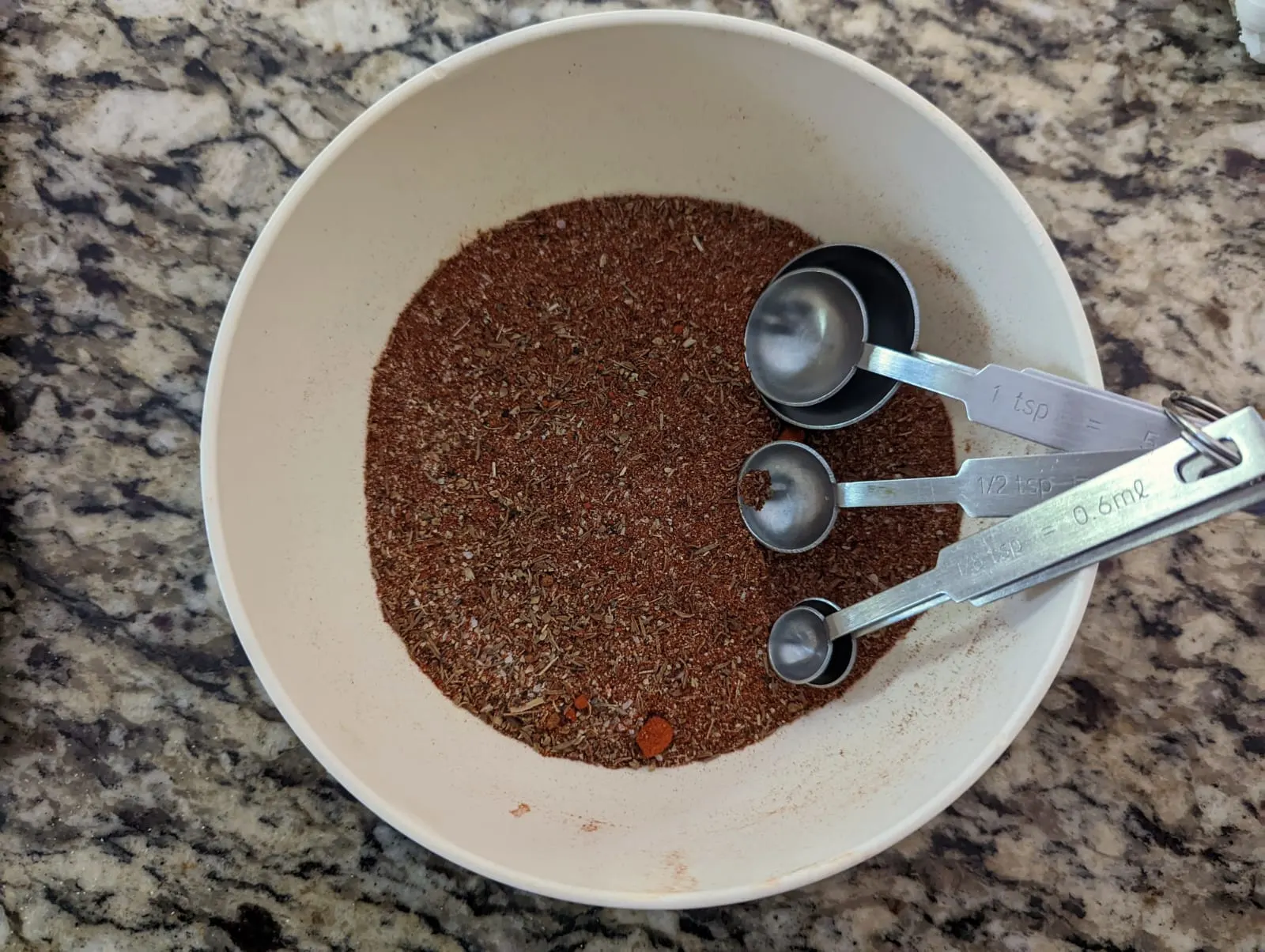 Cajun seasoning in a small bowl.