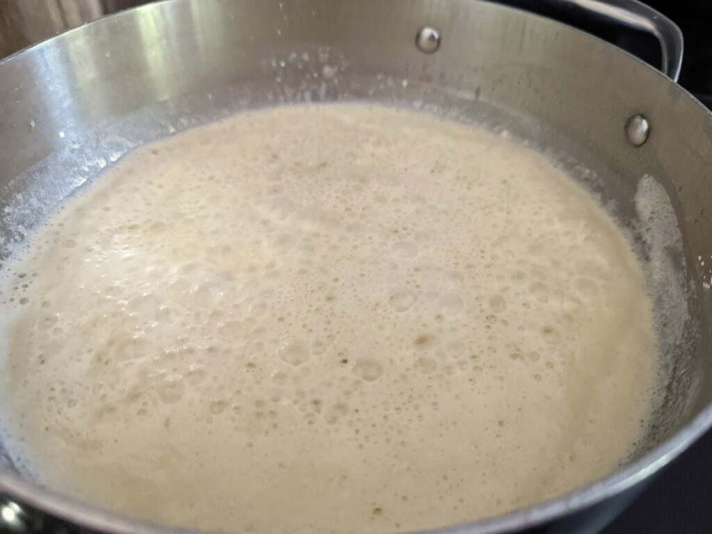 Gluten-free blond roux cooking in a pan.