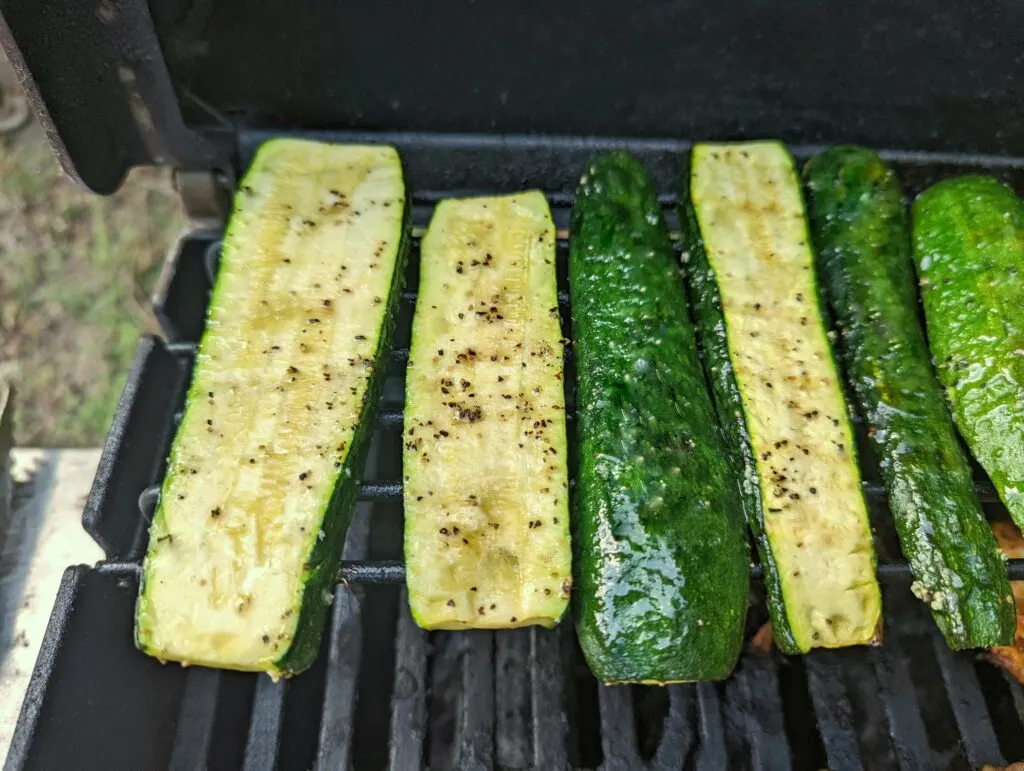 Set the zucchini strips on the grill furthest away from the flame.