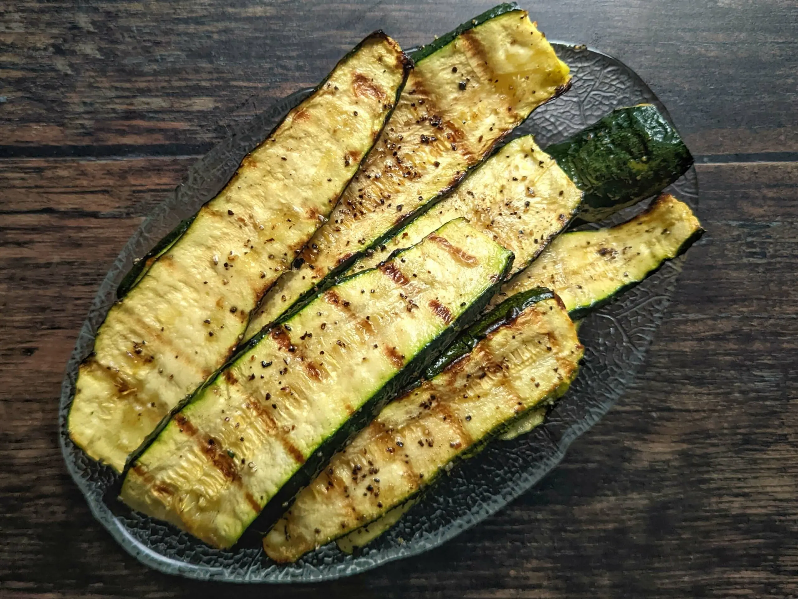 Grilled zucchini in a serving dish.