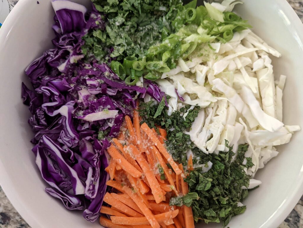 Pour the dressing over the shredded vegetables and combine.