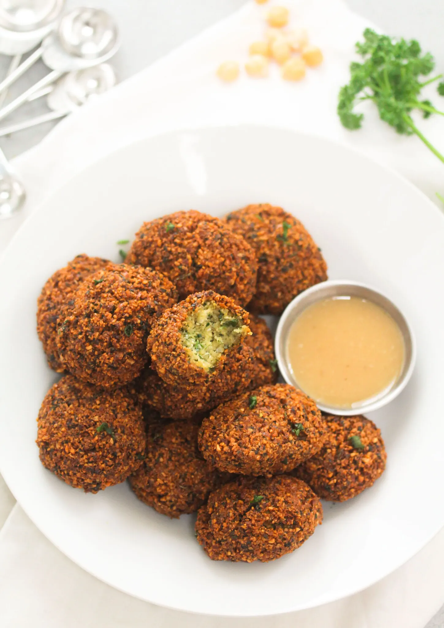 Falafels on a plate with homemade tahini.