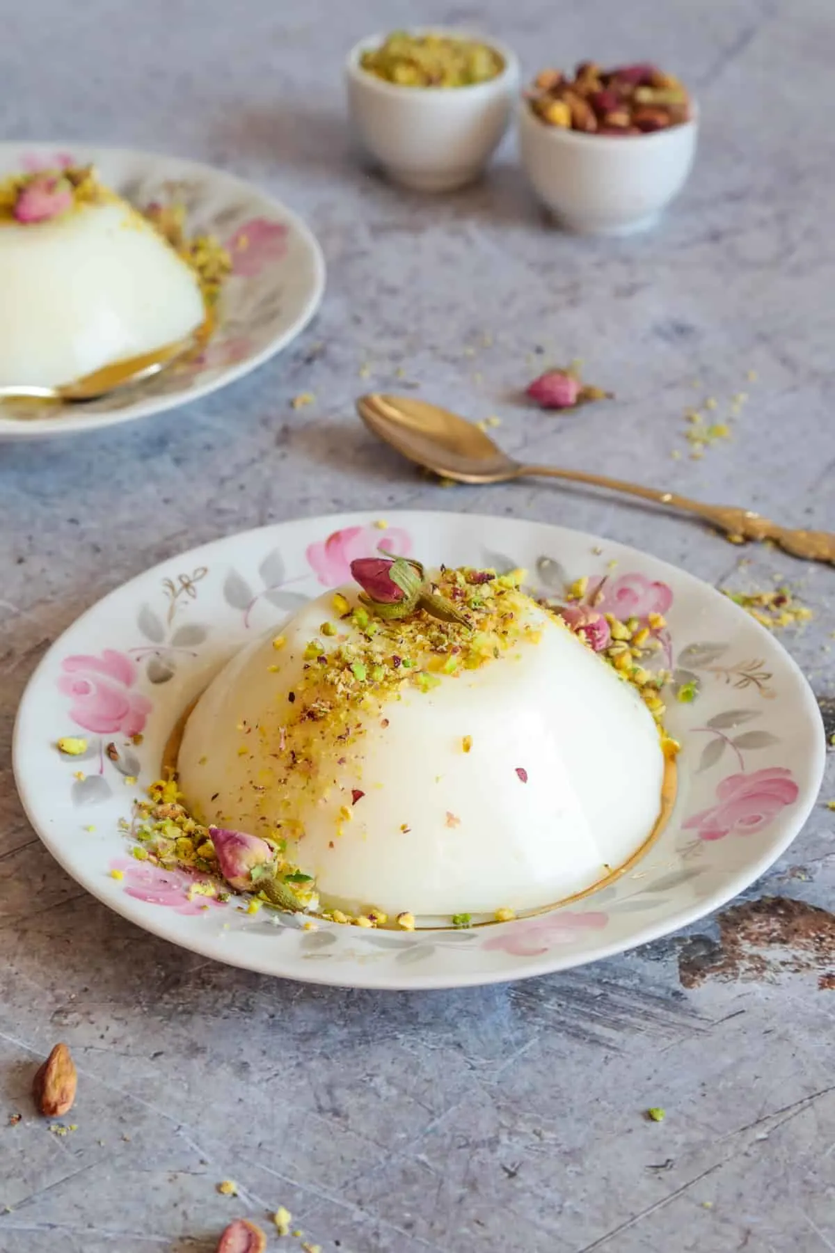 Muhalabieh is a milk pudding that's infused with rosewater and topped with crushed pistachios.