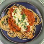 Air fryer chicken parmesan served over spaghetti noodles.