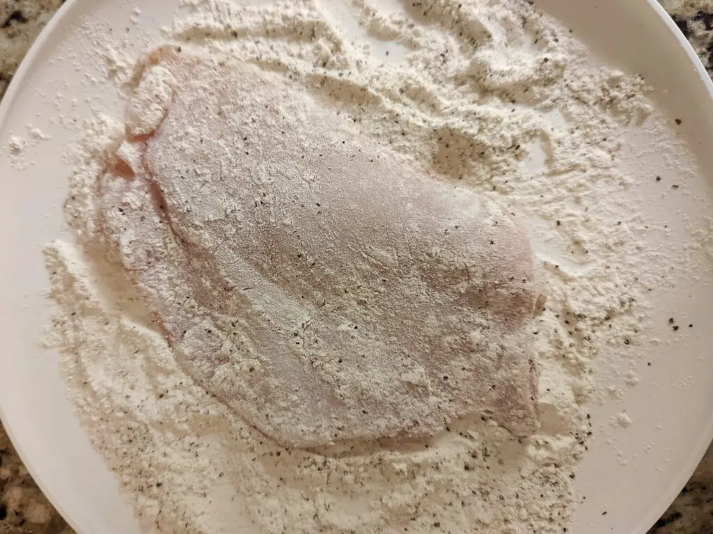 Chicken dipped in flour.