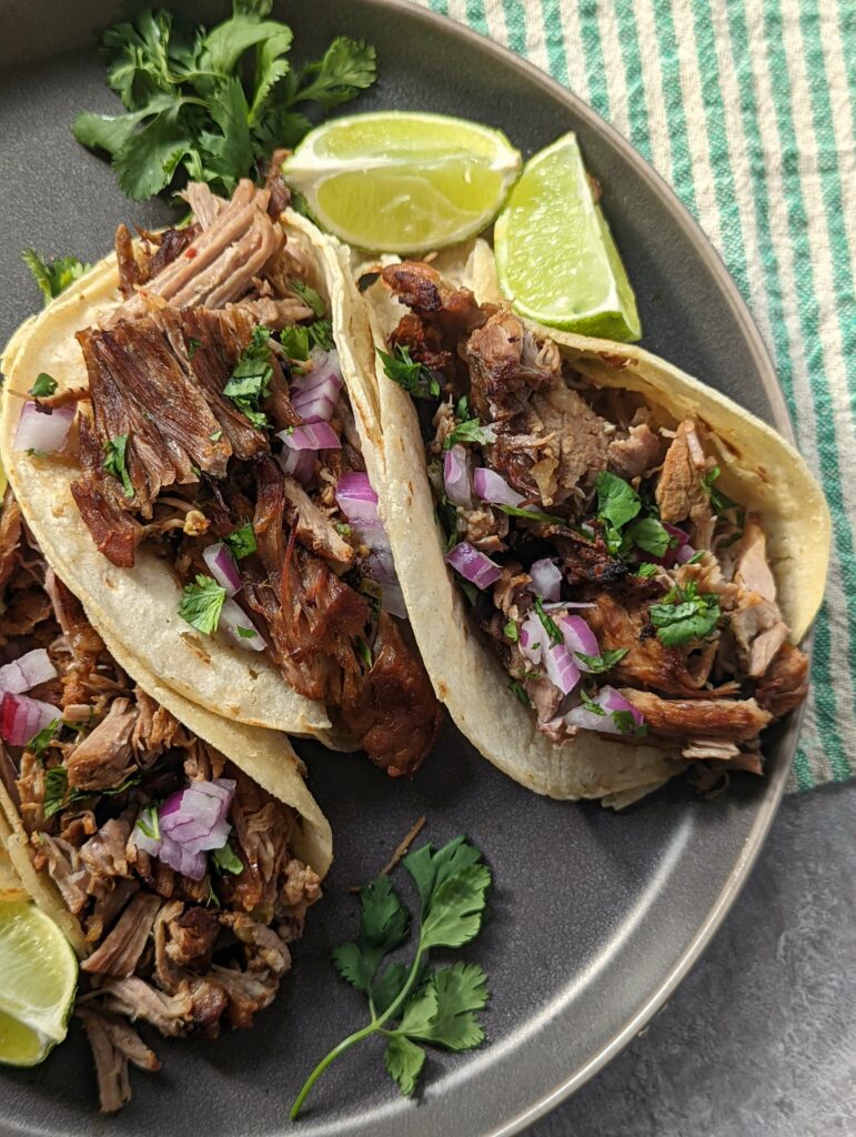 Garnish our Instant Pot Carnitas with onion and cilantro.