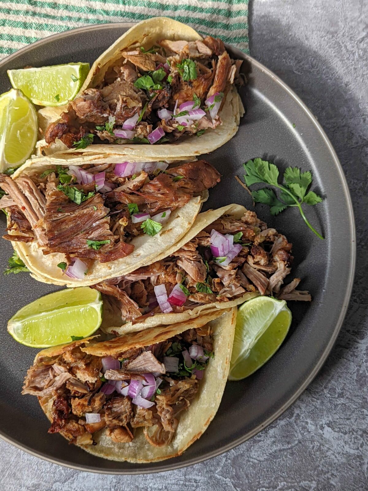 Instant Pot carnitas tacos on a plate.