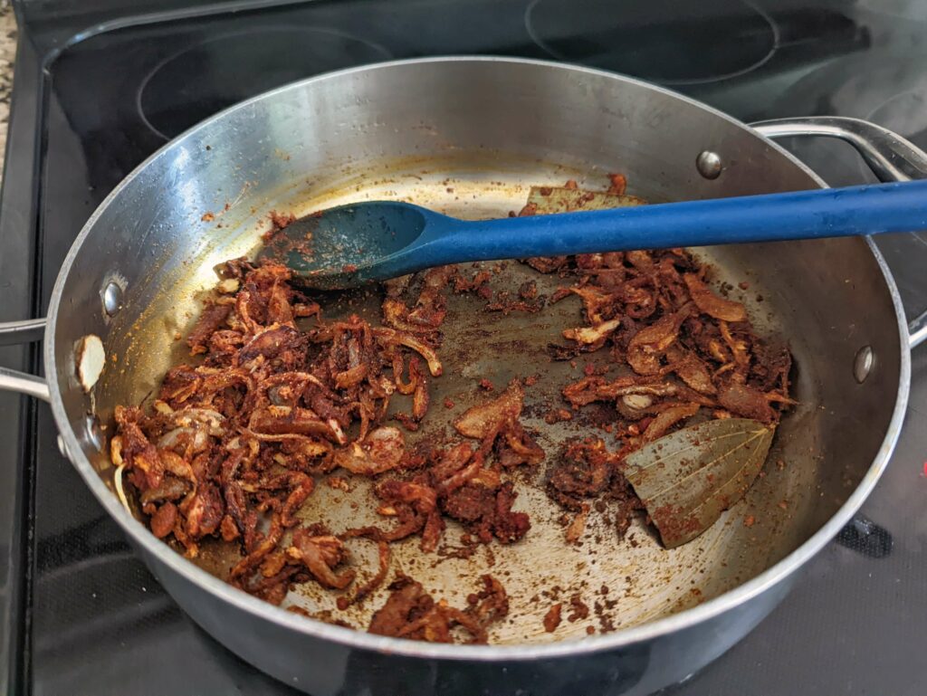 Stir the spices into the onion mixture.