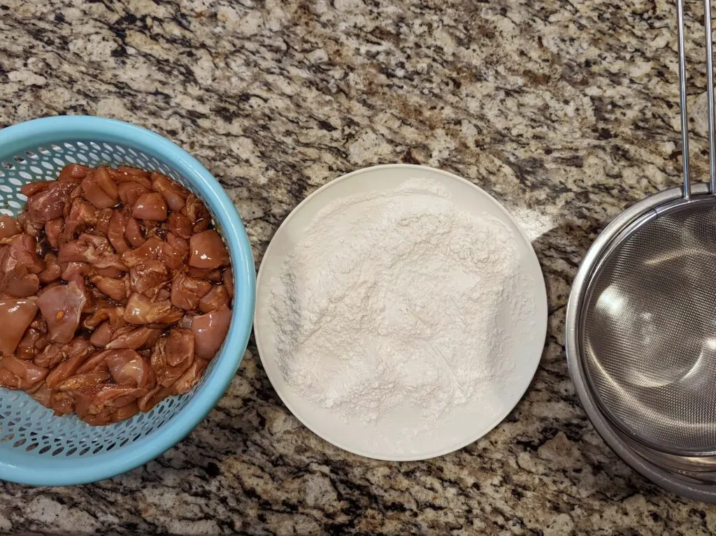 The ingredients for the coating and sauce ready on the table.