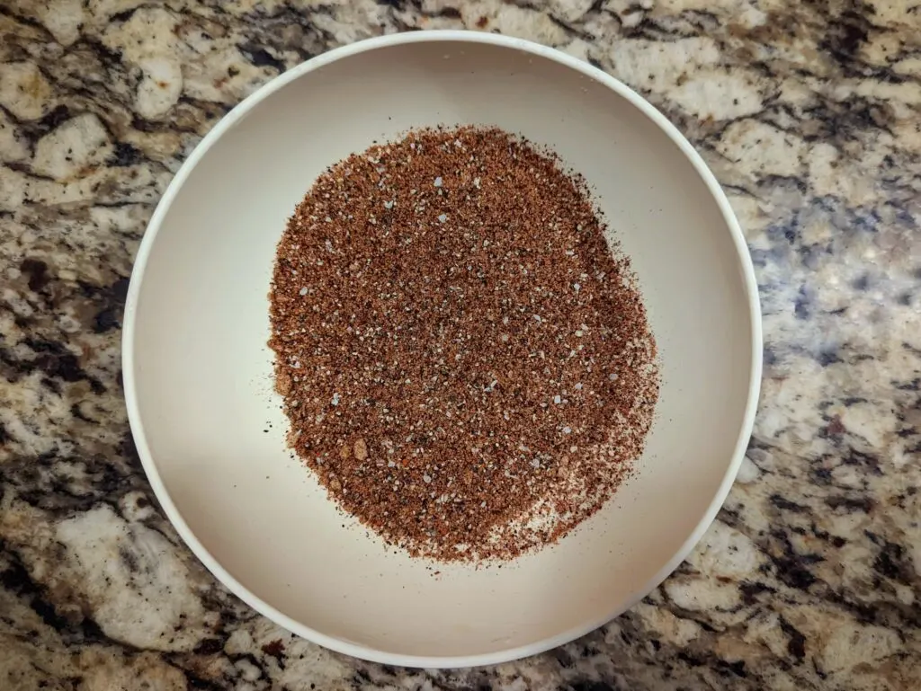 Combine the spices in a small bowl to make up our rib rub recipe.