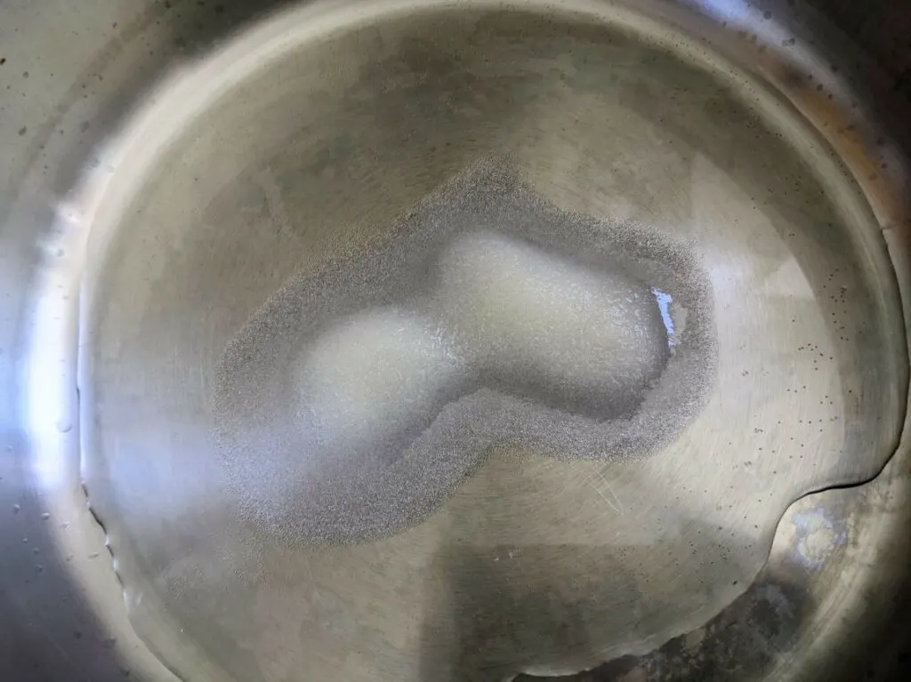 Bring coconut water and sugar to a boil.