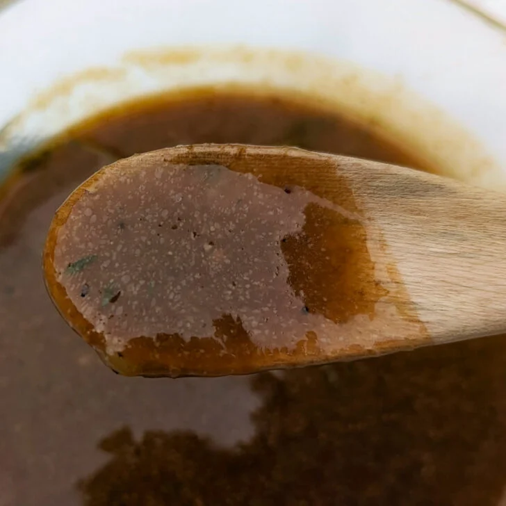 Homemade beef gravy in a pan.