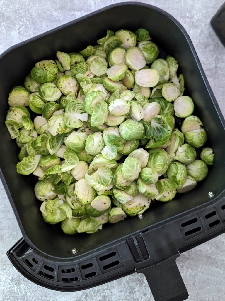 Add the air fryer Brussel sprouts to the basket.