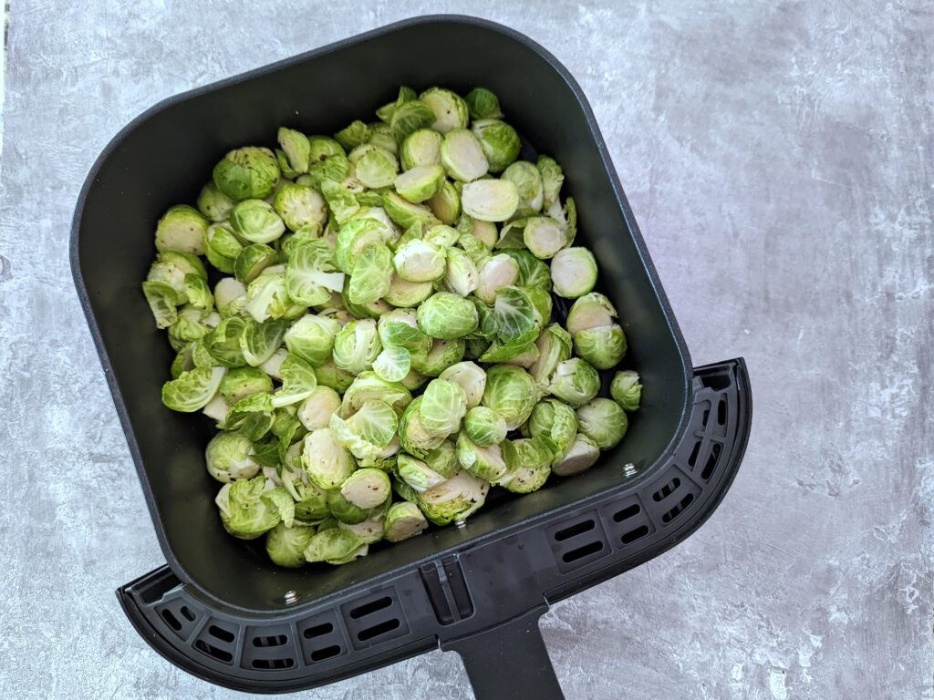 Add the air fryer Brussel sprouts to the basket.