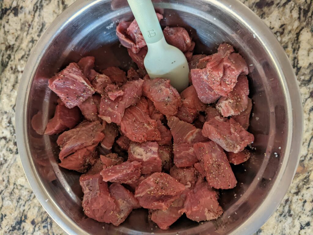 Season the beef with salt and pepper.