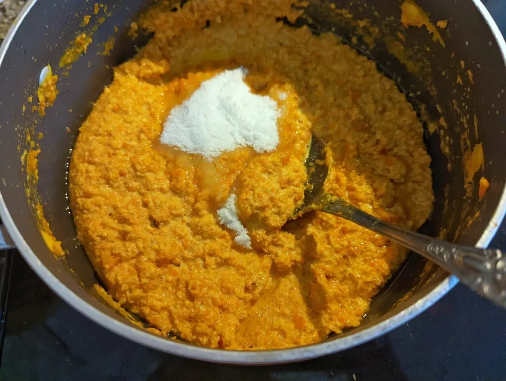 Add the ghee and sugar to the carrot and milk.