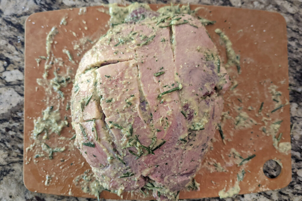 A lamb roast coated with the herb mixture.