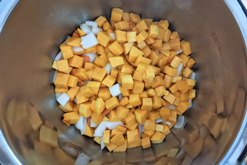 Butternut squash and other vegetables cooking in the Instant pot.