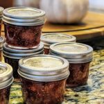 Our fig jam recipe divided in jars stacked on the counter.