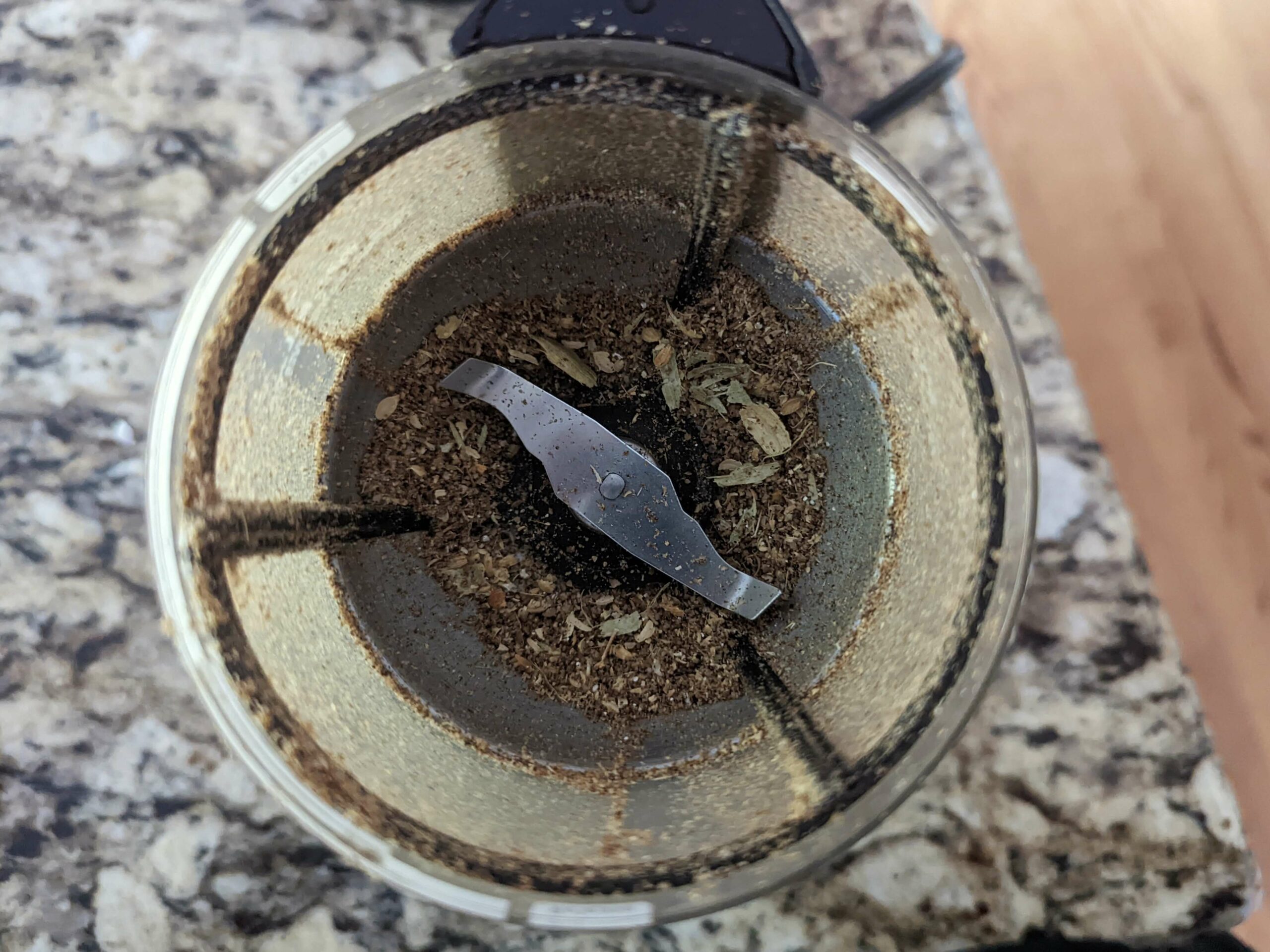Whole spices toasting in a grinder. 