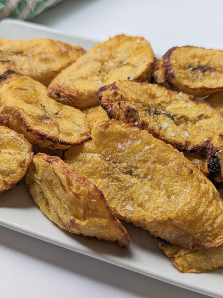 Air fried plantains on a serving plate.