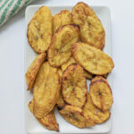 Air fried plantains on a plate.