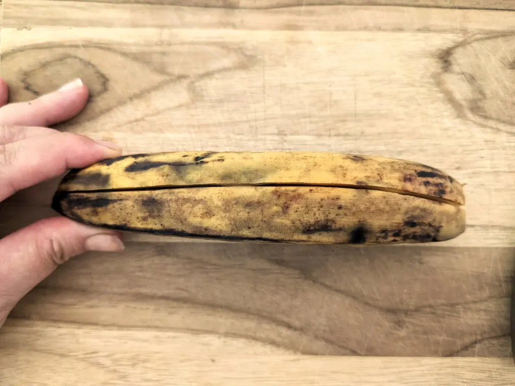 Slit the plantain from end to end.