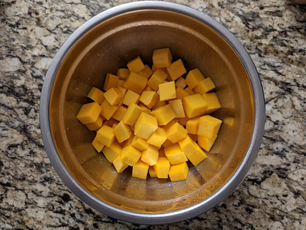 Butternut squash in a bowl with spices.