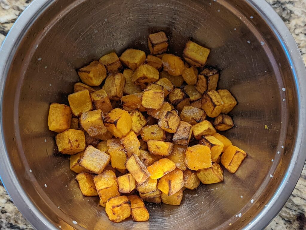 Butternut squash in a bowl with spices.