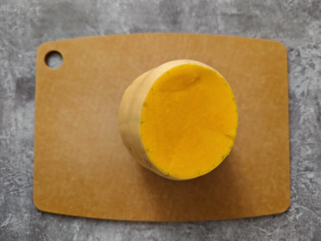 The end cut off of a butternut squash.