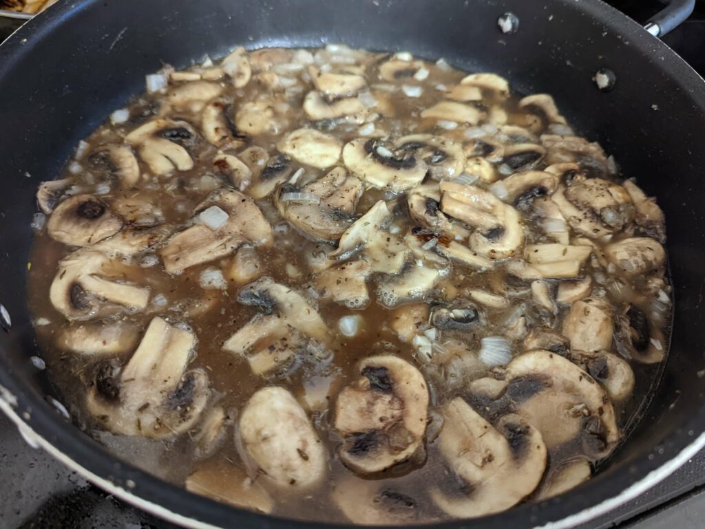 Deglaze the pan with sherry and beef broth.