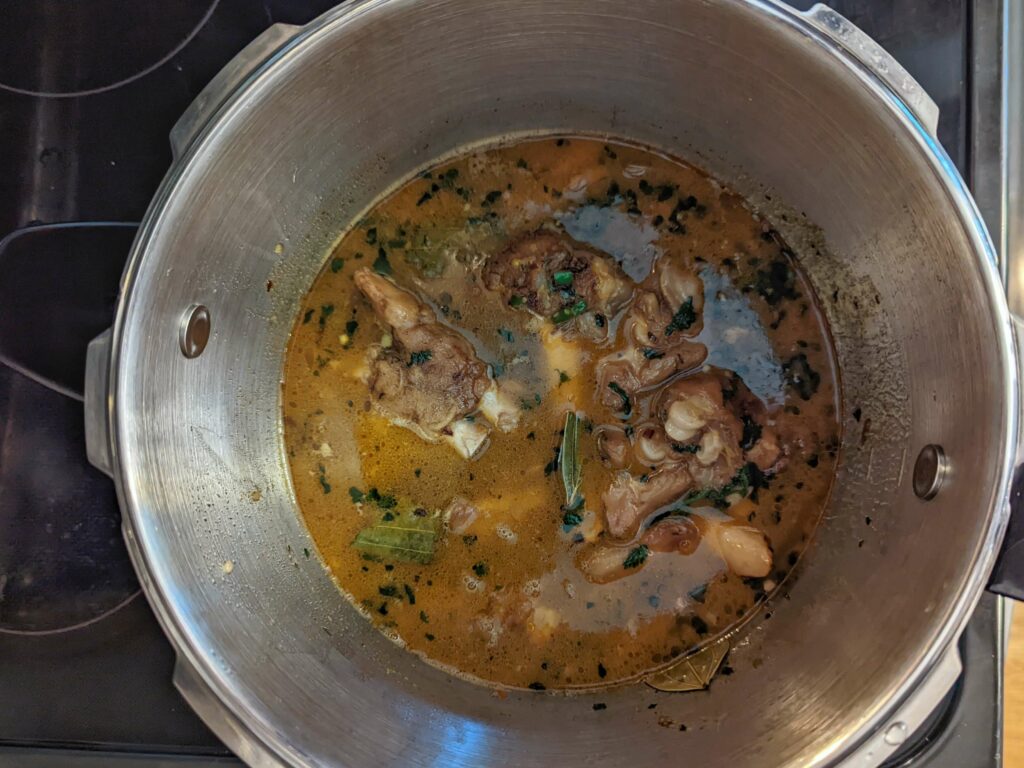 Baghar stirred into the mutton paya soup.