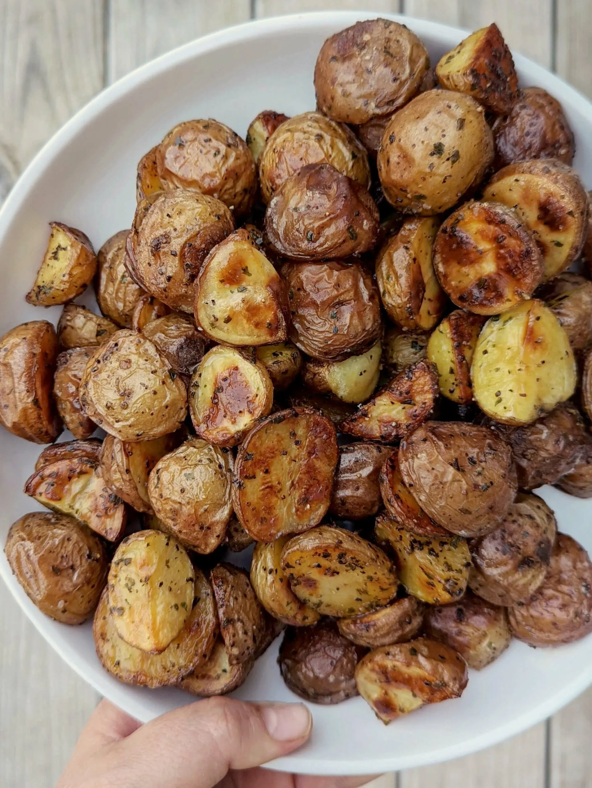 Roasted potatoes on a serving plate.