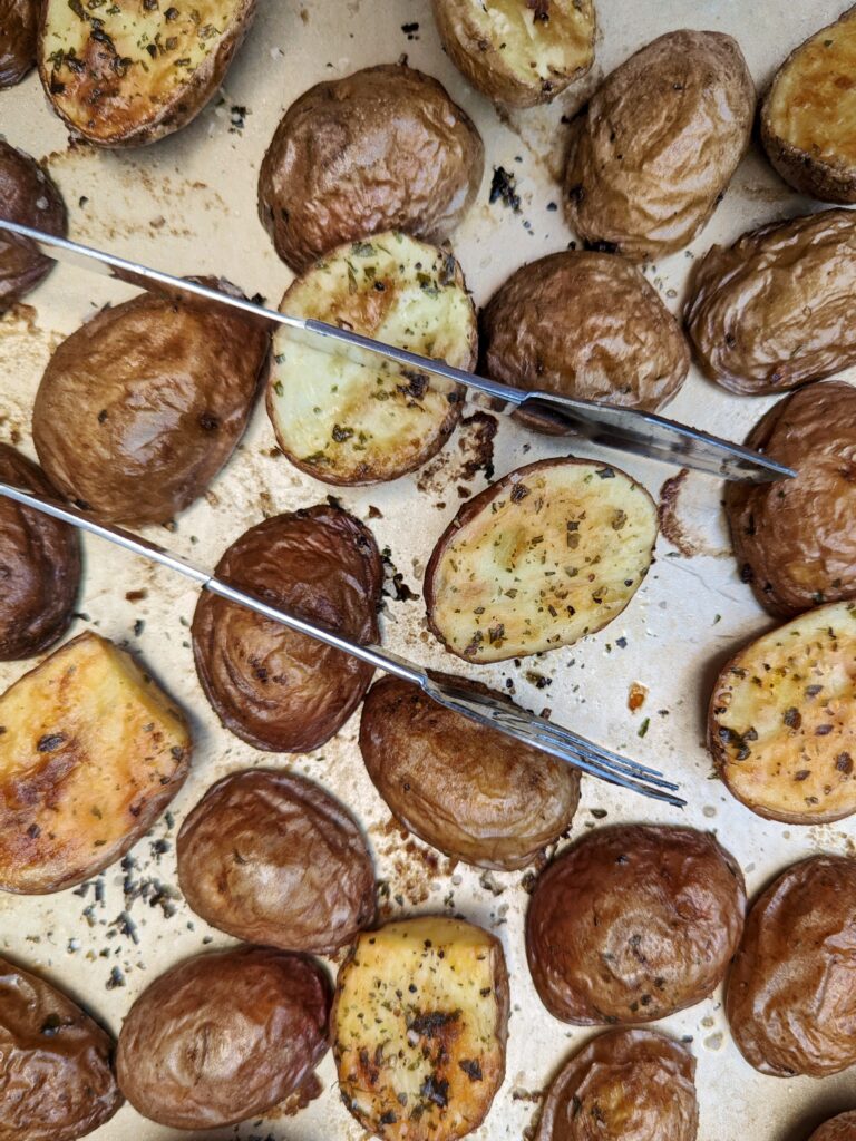Roasted potatoes on a sheet pan.