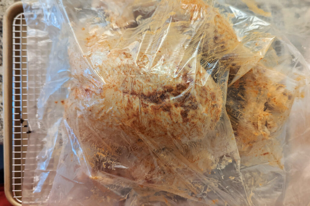 The turkey added to a turkey bag.
